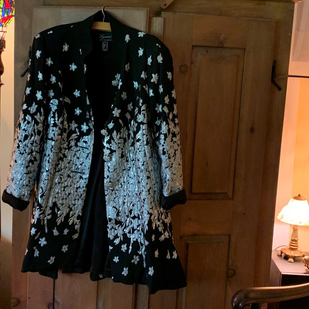 Lyman coat size 14 can fit 8-10 , Black and Silver.